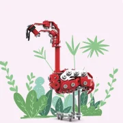 Flamingo op roze achtergrond met groene planten rondom