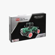 Verpakking groene tractor met rode velgen